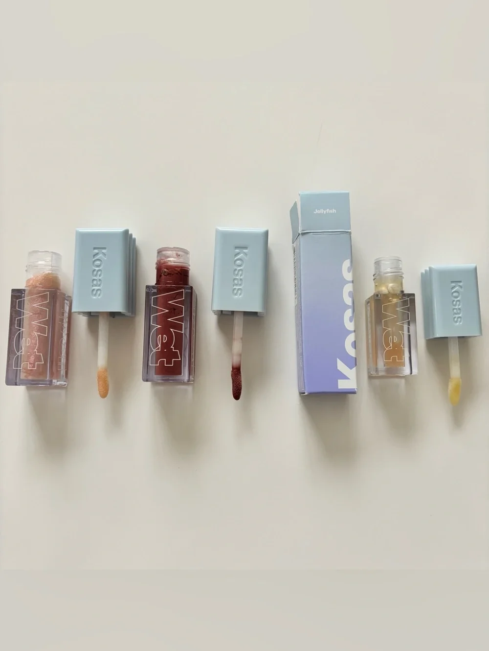 Kosas Wet Lip Oil Plumping Gloss in Unbuttoned, Exposed, and Jellyfish